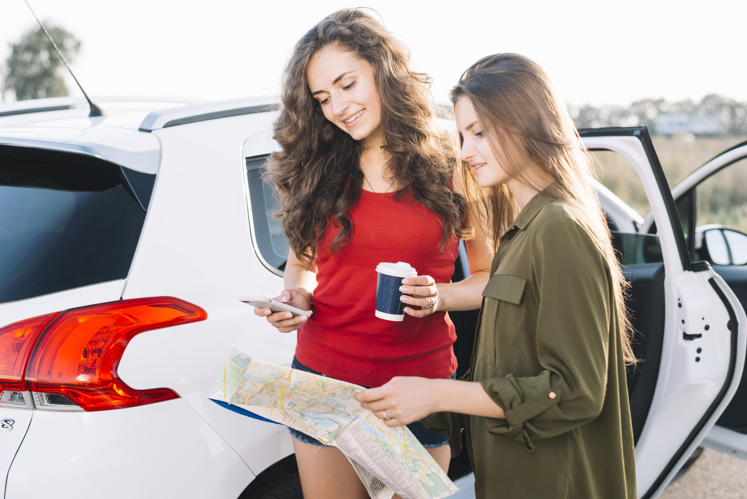 young women searching way with road map scaled